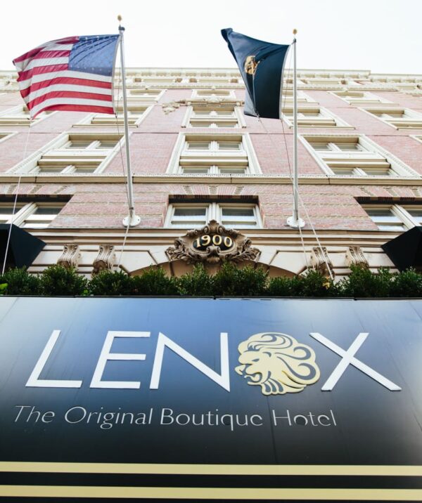 Lenox hotel exterior at an angle with flags and hotel sign