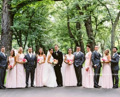 Bride, Groom, and wedding party pose for a photo