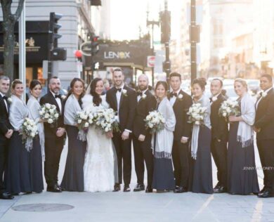 Bride, Groom, and wedding party pose for photo outside Lenox