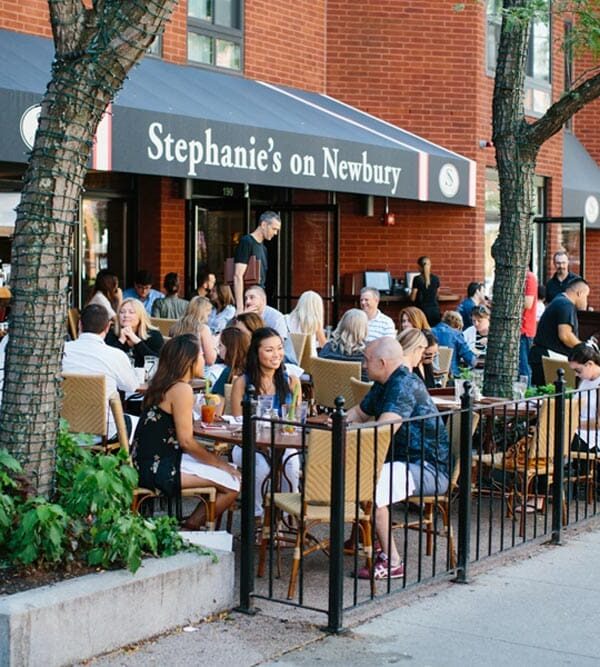 guests dining on patio at Stephanie's on Newbury