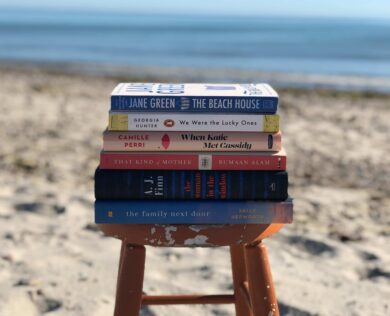 stack of books on the beach